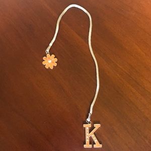 “K” initial bookmark with orange flower